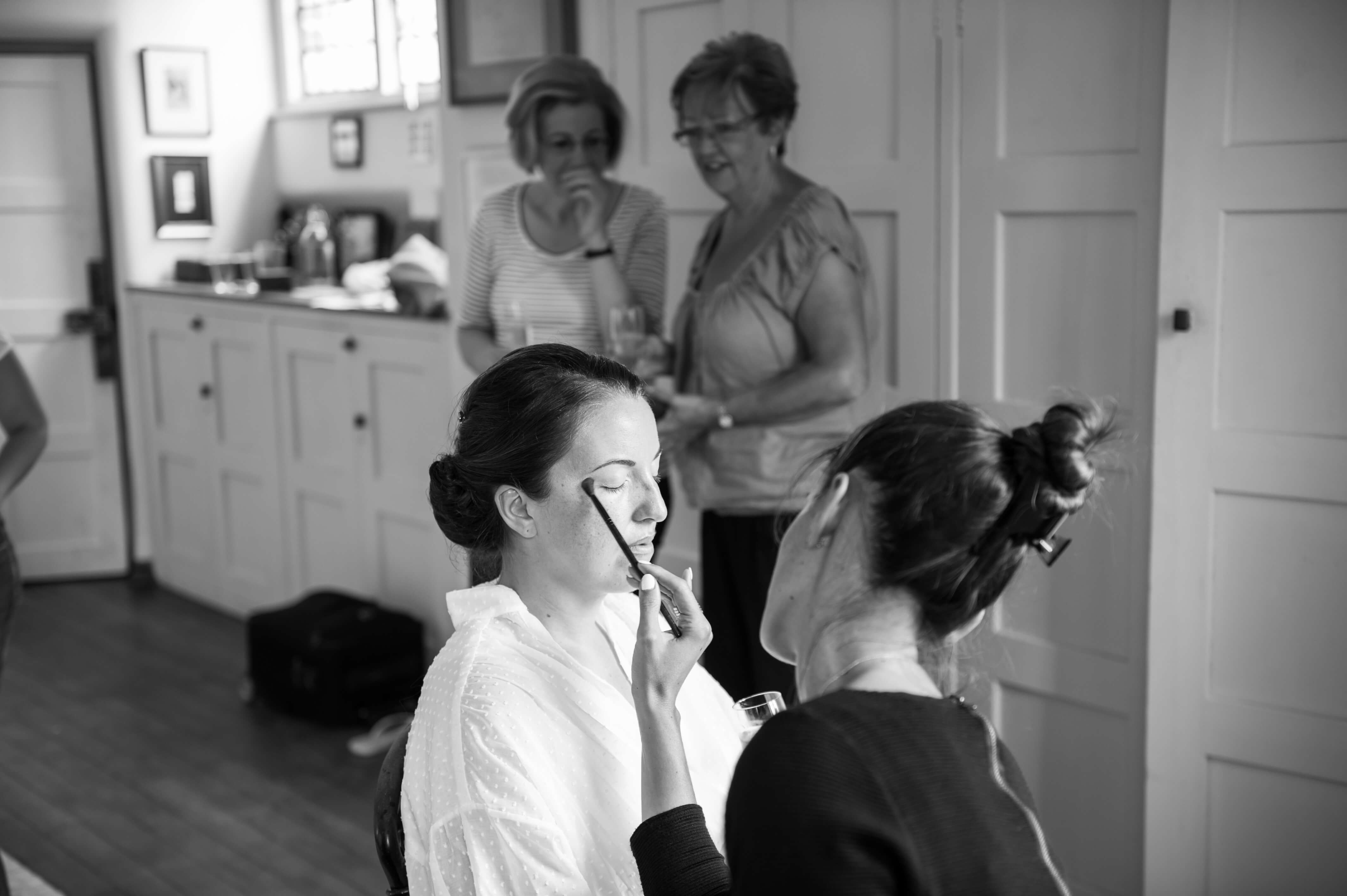 A bride at Voewood getting her make-up done